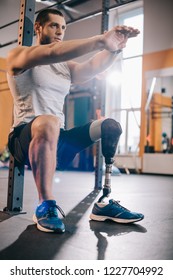 Handsome Young Sportsman With Artificial Leg Working Out At Gym