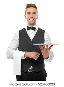 Handsome young waiter with metal tray on white background