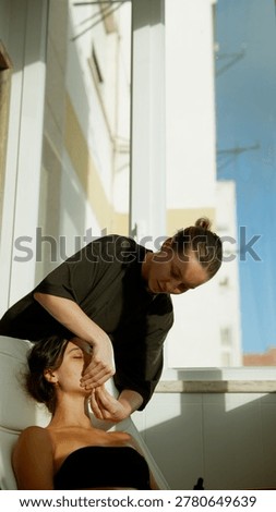 Handson training session with focused students learning facial techniques