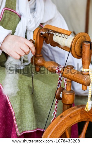 hand-spun yarn at the spinning-wheel