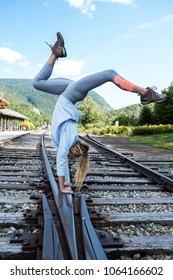 Handstand on train tracks.