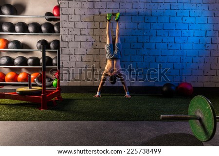 Handstand push-up man workout at gym push ups