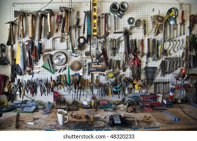 Hand-tools Organized On A Pegboard In A Home Shop Above A Workbench.