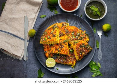 Handvo is a savory Indian cake made from fermented rice and lentil batter, mixed with vegetables and spices. Selective Focus.  - Powered by Shutterstock