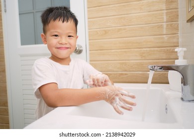 Handwashing, Cute Little Asian 5 Years Old Kindergarten Boy Child Washing Hands By Himself On Sink And Water Drop From Faucet In Toilet, Hygiene Habits For Kids Concept, Soft And Selective Focus