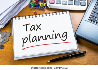 Handwriting Of Tax Planning As Memo On Working Table