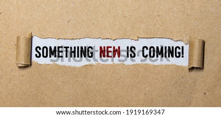 Handwriting text Coming Soon. Concept meaning something is going to happen in really short time of period Colored clipboard blank paper sheet marker old wooden vintage background.