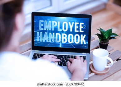 Handwriting Text Employee Handbook. Concept Meaning Document That Contains An Operating Procedures Of Company Woman Typing On Laptop Beside Coffe Mug And Plant Working From Home.