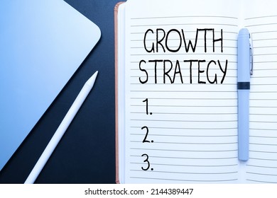 Handwriting text Growth Strategy. Concept meaning Strategy aimed at winning larger market share in shortterm Office Supplies Over Desk With Keyboard And Glasses And Coffee Cup For Working - Shutterstock ID 2144389447