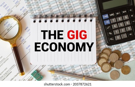 Handwriting Text Writing The Gig Economy. Concept Meaning Market Of Short-term Contracts Freelance Work Temporary White Vertical Paper Written Three Words With Black And Red Color.