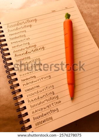 Handwriting written in different fonts in a notepad with a carrot shaped mechanical pencil.
