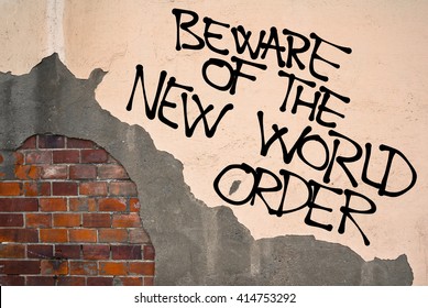 Handwritten Graffiti Beware Of The New World Order Sprayed On The Wall, Anarchist Aesthetics. Caution On Conspiracy Theory About Secret Totalitarian World Government 