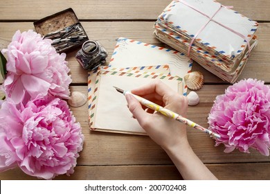 Handwritten Letters And Bouquet Of Pink Peonies