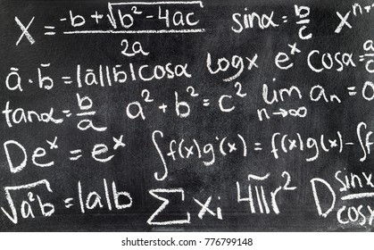 Handwritten Mathematical Formulas On Blackboard Written With Chalk. Chalkboard Full Of Theory And Calculations. Math Equation Background.