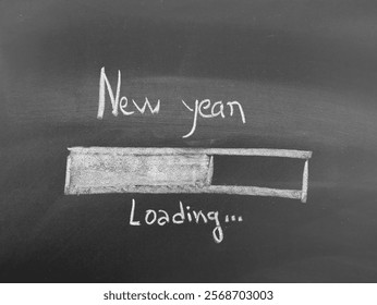 Handwritten message 'New Year Loading' with progress bar on black background symbolizing anticipation for New Year celebrations - Powered by Shutterstock - Get 15% off with code: PIKWIZARD15