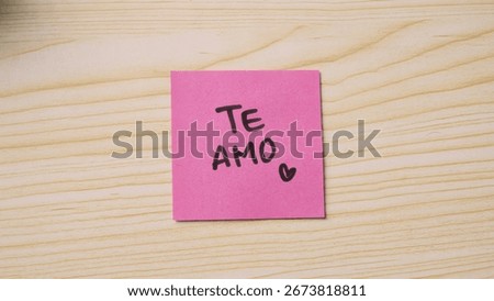 Handwritten “Te Amo” message on sticky note. Handwritten “I love You” message on sticky note. 