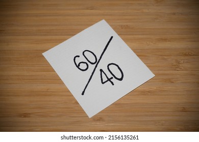 Handwritten note on oak table - "60 40". - Shutterstock ID 2156135261