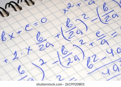 Handwritten notes showcase algebraic equations and calculations in a notebook.