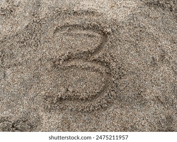 Handwritten number 3 (three) on beach sand - Powered by Shutterstock