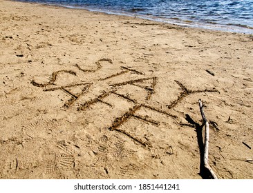 Handwritten On Sand Beach Surface In The Daytime With No People, 