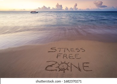 Handwritten Stress Free Zone On Sandy Beach At Sunset,relax And Summer Concept,Dominican Republic Beach.