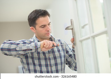 Handyman Fitting A New Door