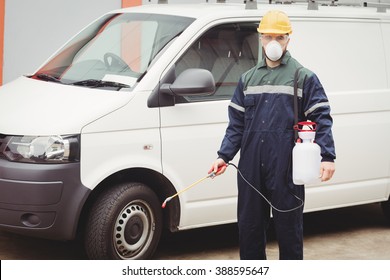 Handyman with insecticide standing in front of his van - Powered by Shutterstock