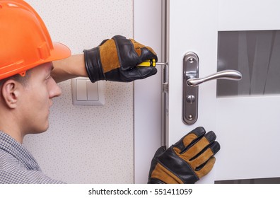 Handyman Repair The Door Lock In The Room