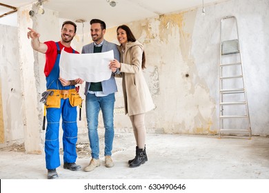 Handyman Shows Young Couple Details Blueprints Stock Photo 630490646 ...