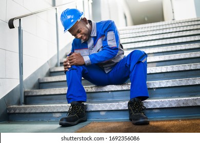 Handyman Sitting On Staircase After Slip And Fall Accident