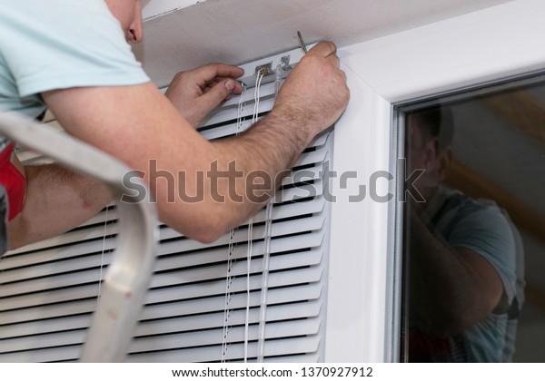 Handyman Uniform Installing New Window Blinds Stock Photo Edit Now 1370927912