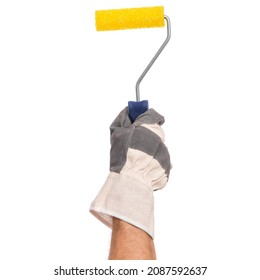 Handyman with work glove holding a paint tool. Male hand wearing working glove with paint roller isolated on white background.