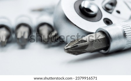 Handyman  wrench tool screwdriver bits macro close up on white