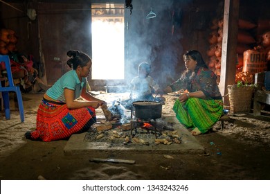 Hang Dong Commune, Bac Yen District, Son La Province, Vietnam -January 7, 2019: Picture Of A H'mong Ethnic Minority Family Cooking With A Wood Stove In Their Home In Hang Dong Commune, BacYen. VN