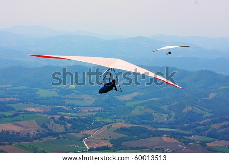 Hang glider flying in the Italian mountains