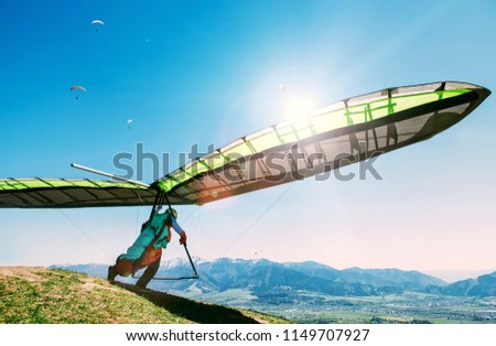 Hang glider launch from top of hill
