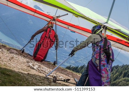 hang gliders taking off