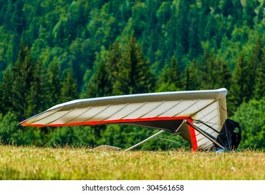 Hang Gliding Air Sport. Non-Motorized Foot-Launch Aircraft. Hang Glider On A Meadow