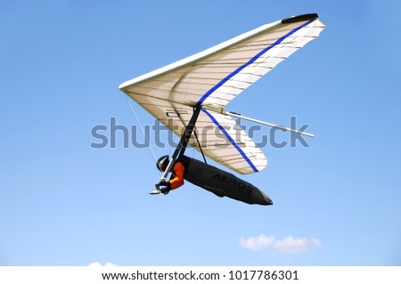 Hang Gliding in the bright blue sky. Hanggliding in Tirol, Austria, Alps, August, 2017.