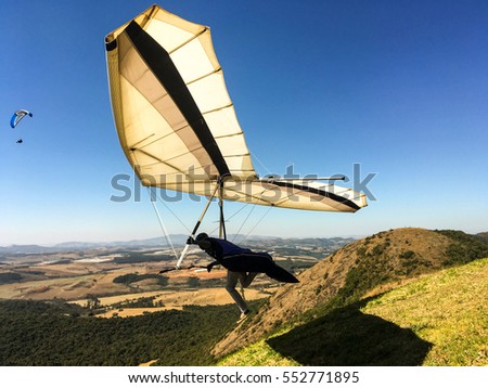 hang gliding launching at beautiful sunny day. Adventure concept