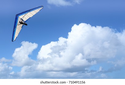 Hang Gliding Over The Ocean On A Cloudy Day