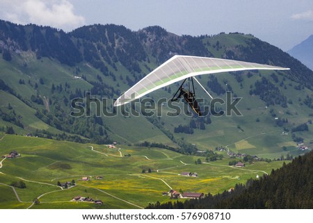 Hang gliding in Swiss Alps, Switzerland, Europe