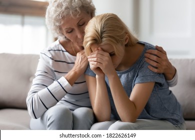 Hang On, My Dear. Affectionate Empathic Aged Elder Female Tender Embracing Calming Quieting Down Lost, Upset Or Grieving Adult Woman Younger Friend, Relative Or Colleague, Helping And Supporting Her