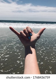 A Hang Ten Sign With An Ocean Background. This Would Be An Awesome Wallpaper Or Background