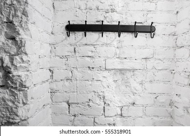 hanger bracket on the background of the painted brick wall