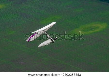 Hangglider wing in flight. Aerial photo