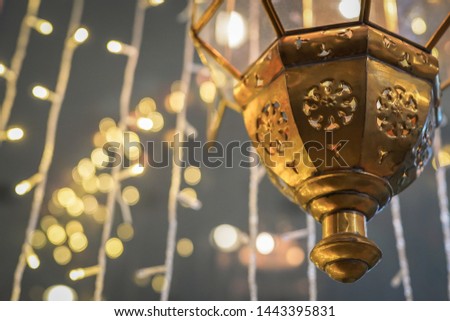 Hanging Arabic lantern with lights background. Photo of Ramadan decoration with copy space. Eid Party Decoration.