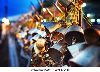 Hanging bells, leaves, are donated to the buddhist  temples  as the raw material to make buddha images. Thailand, Myanmar, Laos. - Shutterstock ID 1395632438