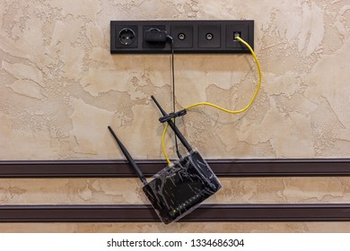 Hanging Black Internet Router At Home Online