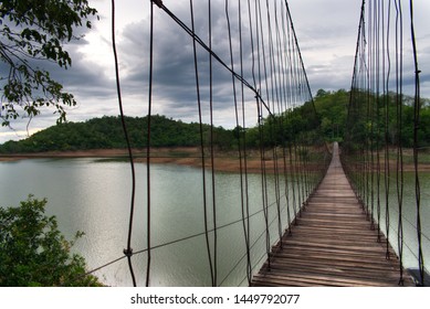 Hanging Bridge over the reservoir at sunset, Kang Krajarn National Park, Petchaburi, Thailand